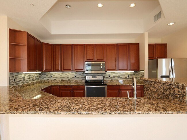 Building Photo - BEAUTIFUL 3-BEDROOM  WATERFRONT CONDO WITH BOAT SLIP AND HEATED POOL