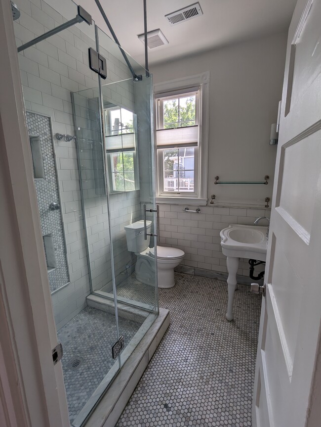 marble bathroom with glass spa shower - 4413 GEORGIA AVE NW