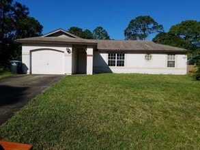 Building Photo - Nice 3 Bedroom 2 Bath home with Large Yard  Close to Jupiter Elementary
