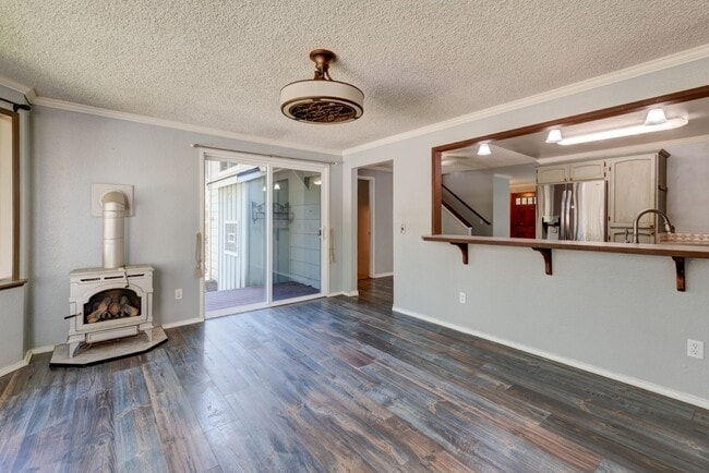 Building Photo - Spacious 4-Bedroom Home with Fireplace, Fenced Yard, and 2-Car Garage