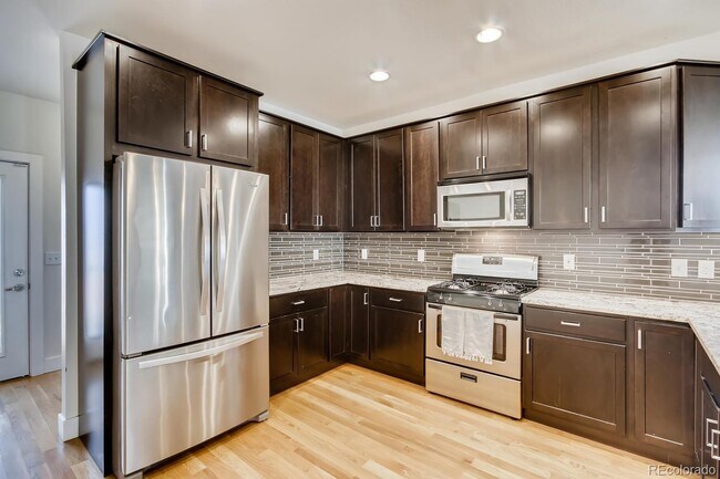 Building Photo - "Charming 2-Bed, 2-Bath Home with Gleaming Hardwood Floors in Vibrant Denver!"
