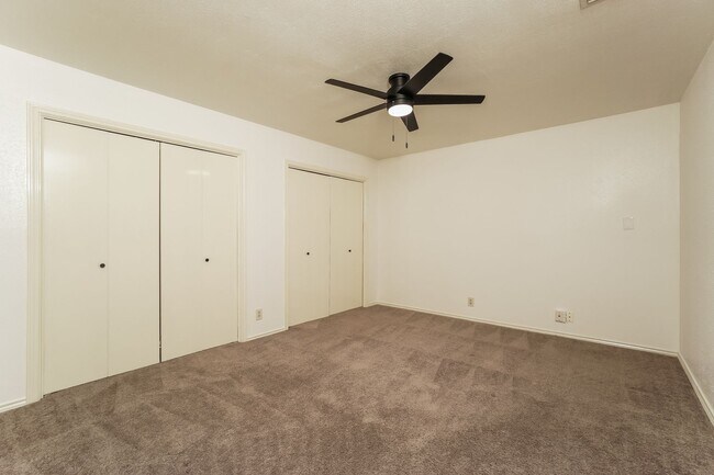 Building Photo - Charming 2-Bedroom Condo in Gated Community Surrounded by Mature Trees