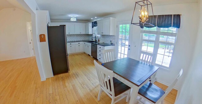 Building Photo - HUGE Backyard + Amazing Patio + Pet Friend...