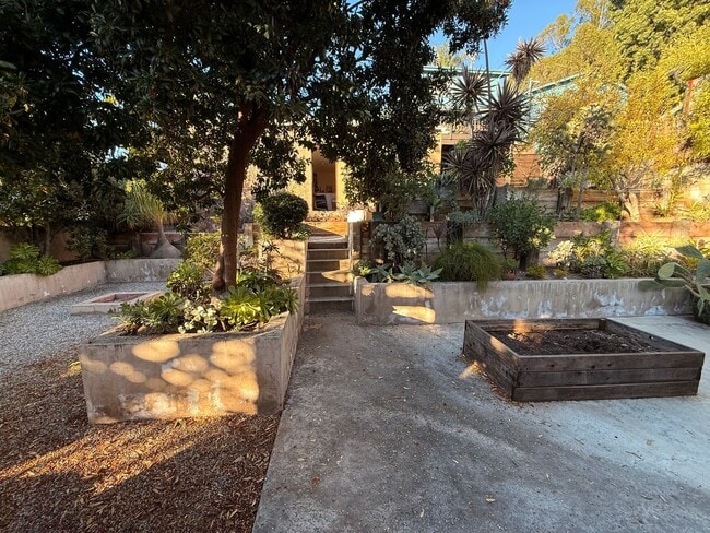 Building Photo - Hilltop Highland Park Sanctuary with Views, Private Gated Yard, In Unit Laundry, Parking & Abunda...