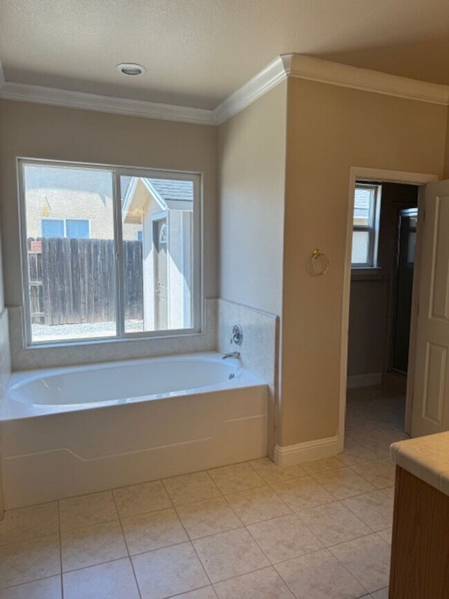 Building Photo - Enterprise Neighborhood 3 Bedroom Home with bonus room and 3 car garage- Landscaping Included!