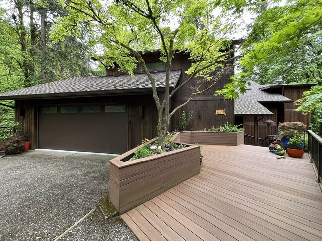 Building Photo - One-of-a-Kind Custom Home with Wall of Windows, Stone Fireplaces, Expansive Entertainment Space &...