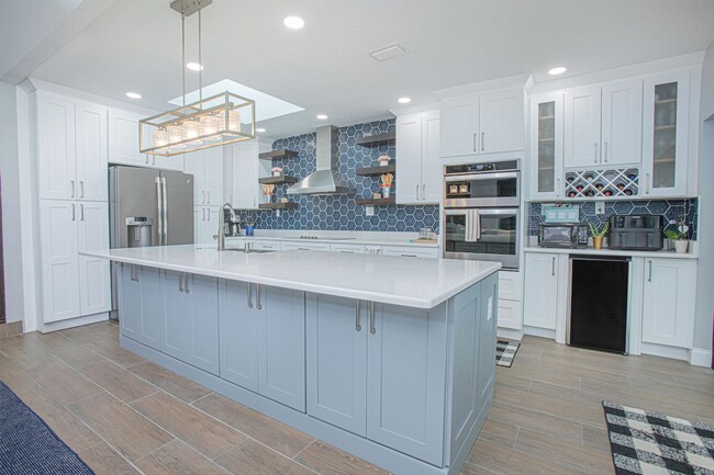 Building Photo - Beautifully Updated 3/2 Pool Home with Large Backyard in Lake Ajay (Gated Community)