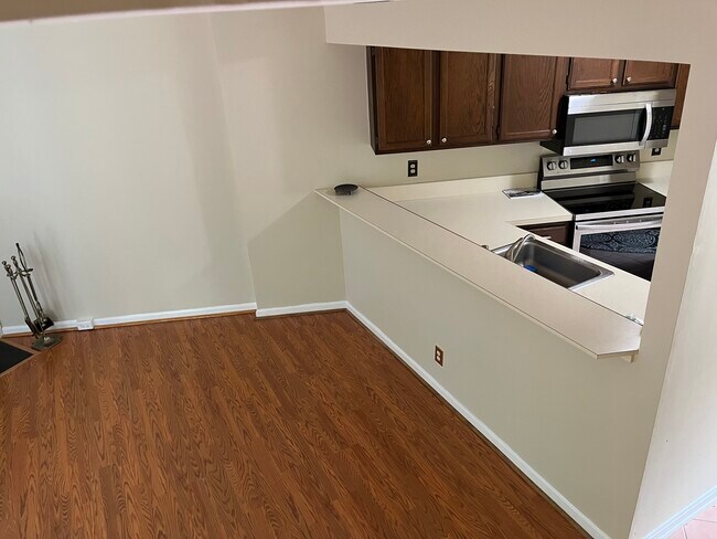 Kitchen adjacent to living room - 11251 Silentwood Ln