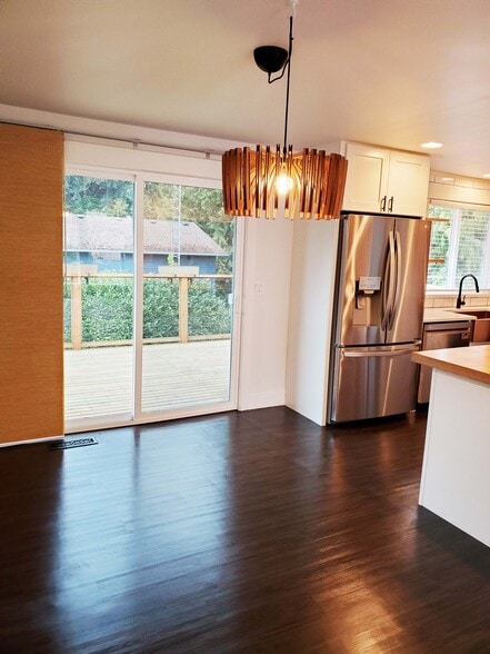 Dining room with deck off it - 8105 Spur Ct NW