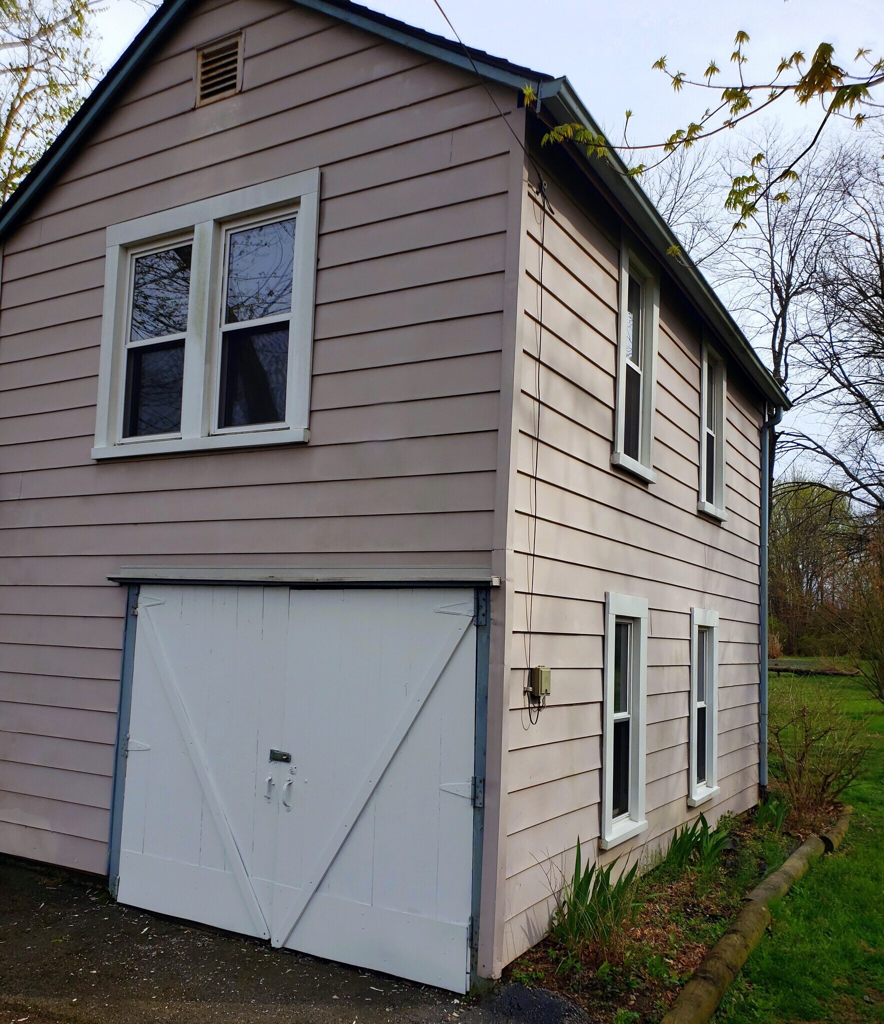 Attached garage with double pane windows and two bedrooms on second floor. - 10106 Wingfield Rd