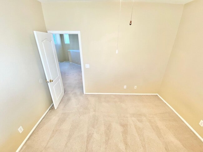 Building Photo - THIS SPACIOUS RESIDENCE FEATURES 4 BEDROOM...