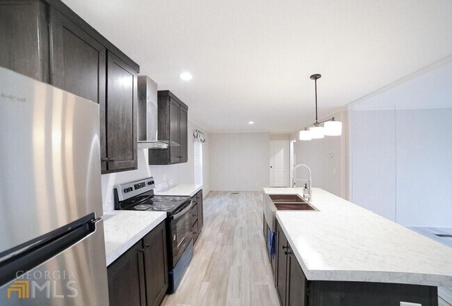 Building Photo - Spacious 4-Bedroom Home with Lawn Maintena...