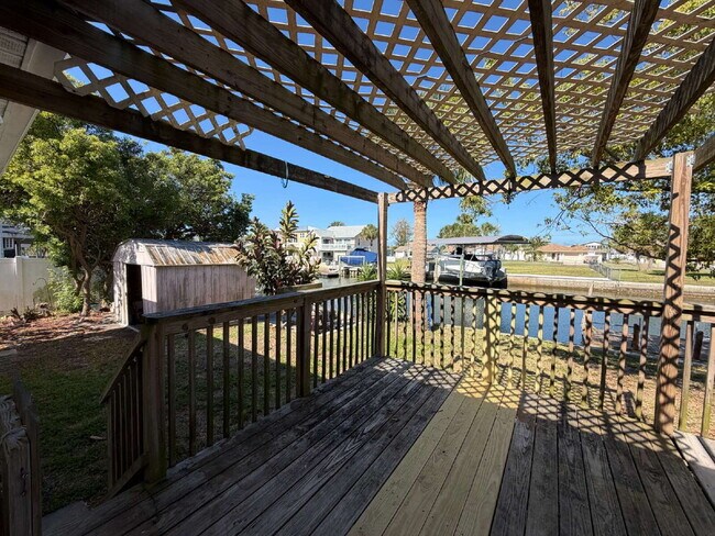 Building Photo - "Waterfront Home with Dock! 3-Bedroom Oasis with 2 Baths and 1,800 Sq Ft of Comfort in Hudson, FL!"