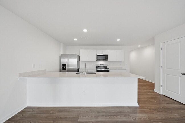 Building Photo - Modern Comfort in a Peaceful Newton Community This newly built 3-bed, 2.5-bath townhome blends mo...