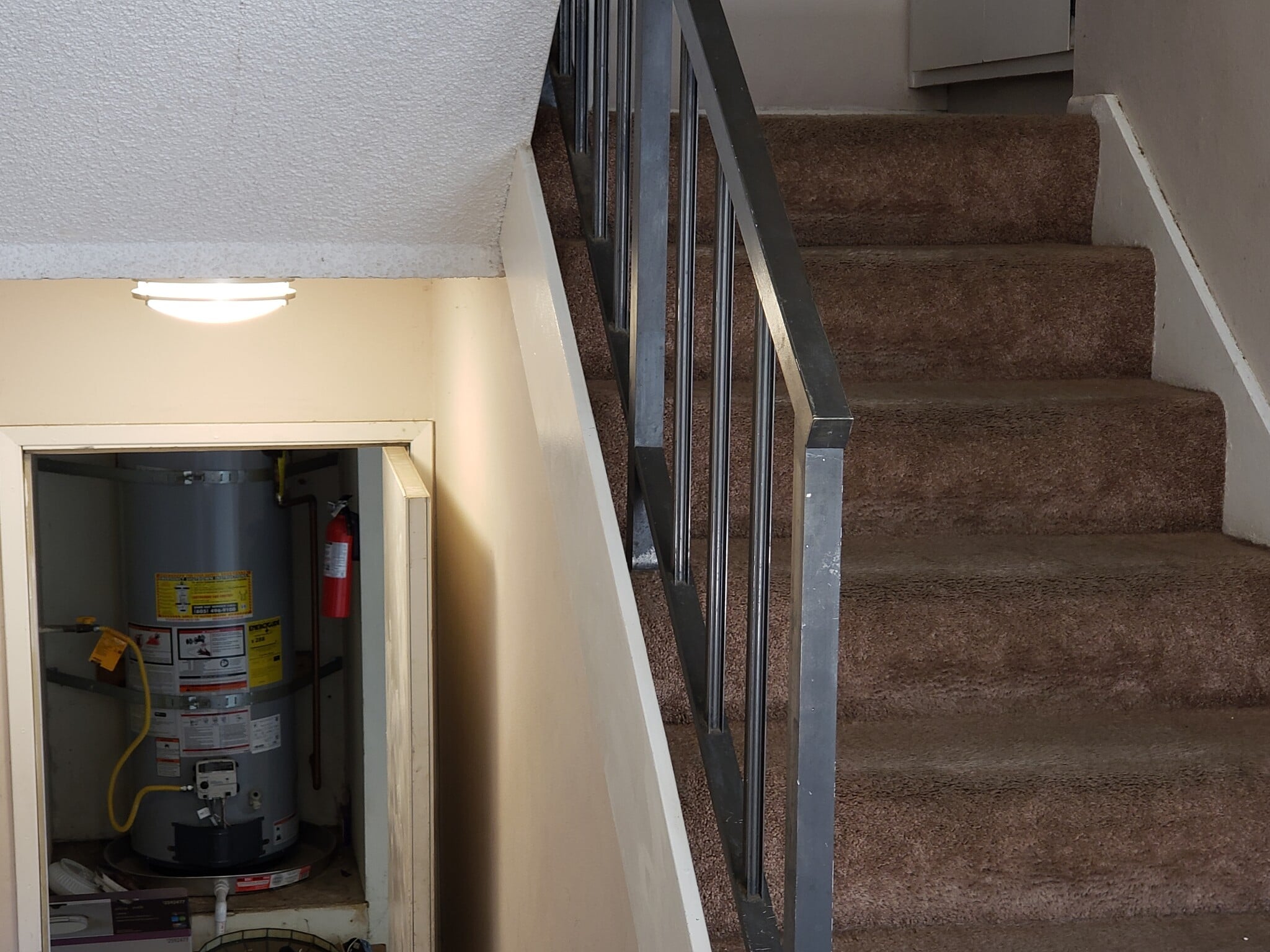 Looking into Garage -- 2 single car garage spaces with washer/dryer hookups and storage - 1360 Alessandro Dr