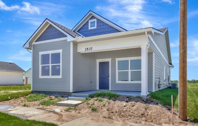 Building Photo - Modern 3-Bed Ranch in Maize – Zero-Entry L...