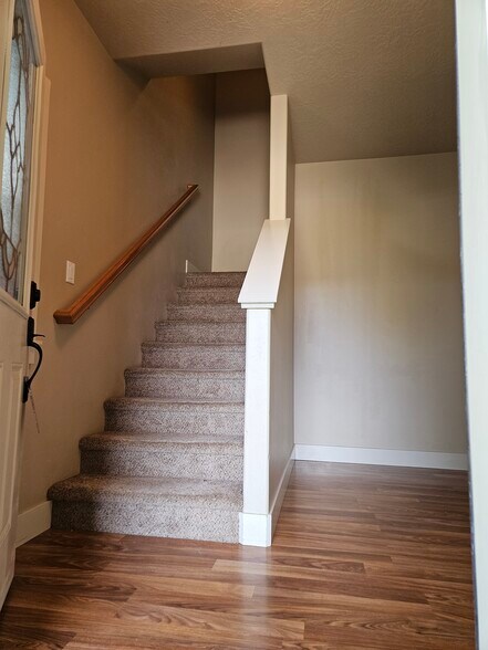 Entry with stairs to bedrooms - 2014 E Mountain Man Dr