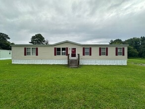 Building Photo - Charm & Commuter Convenience – 3BR/2BA Outside City Limits