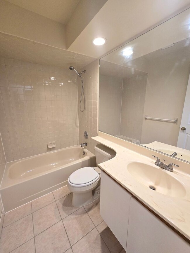 Building Photo - Commuter's delight! Spacious 2nd fl: 2-bed, 2-bath condo with fireplace, washer & dryer & off-str...