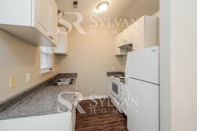 Building Photo - Lease today! No extra charge for contentme...
