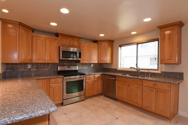 Includes range, microwave/hood, & dishwasher - 3610 W Estates Ln
