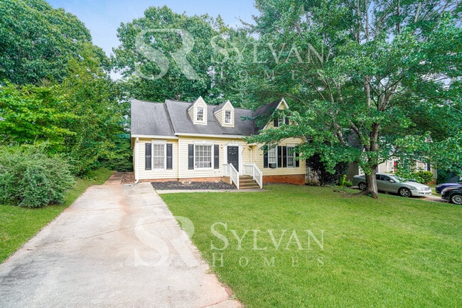 Building Photo - Feel welcome in this well-maintained 4BR 2...
