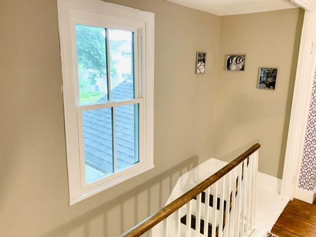 upstairs hallway, stairs down to foyer/front door - 1579 Pleasant St