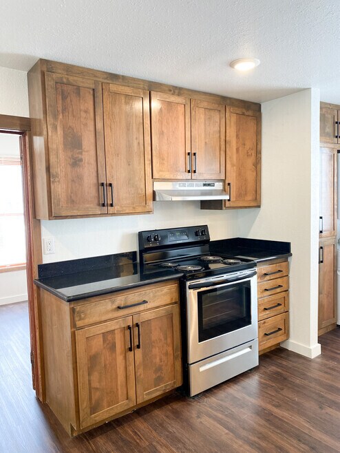 Kitchen area with stove - 719 SW 4th St