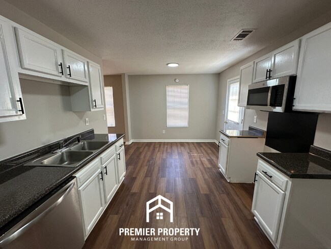 Building Photo - Spacious 4BR/2BA Home in 38141 | Vinyl Flooring & Large Fenced Backyard