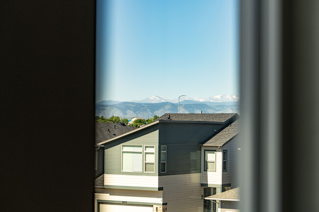 Mountain view from primary bedroom - 2863 W 69th Ave