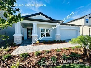 Building Photo - "Luxury Living in Wesley Chapel: Spacious ...