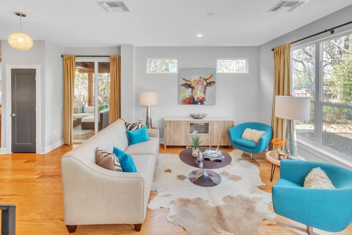 Living room, access to screened porch - 402 Irma Dr