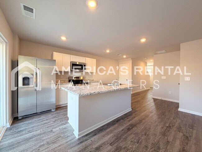 Building Photo - Spacious Two-Story Townhome with Open Layout!