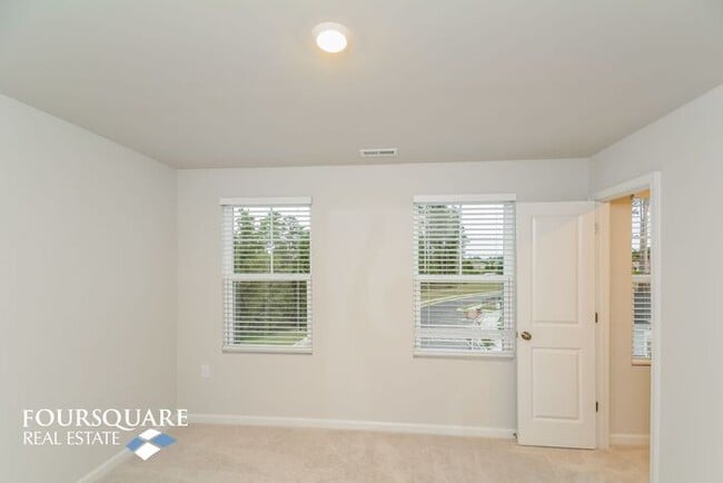 Building Photo - Modern 3-Story Townhome with First-Level Bedroom, Open Floor Plan & Community Pool – Prime RTP Lo...