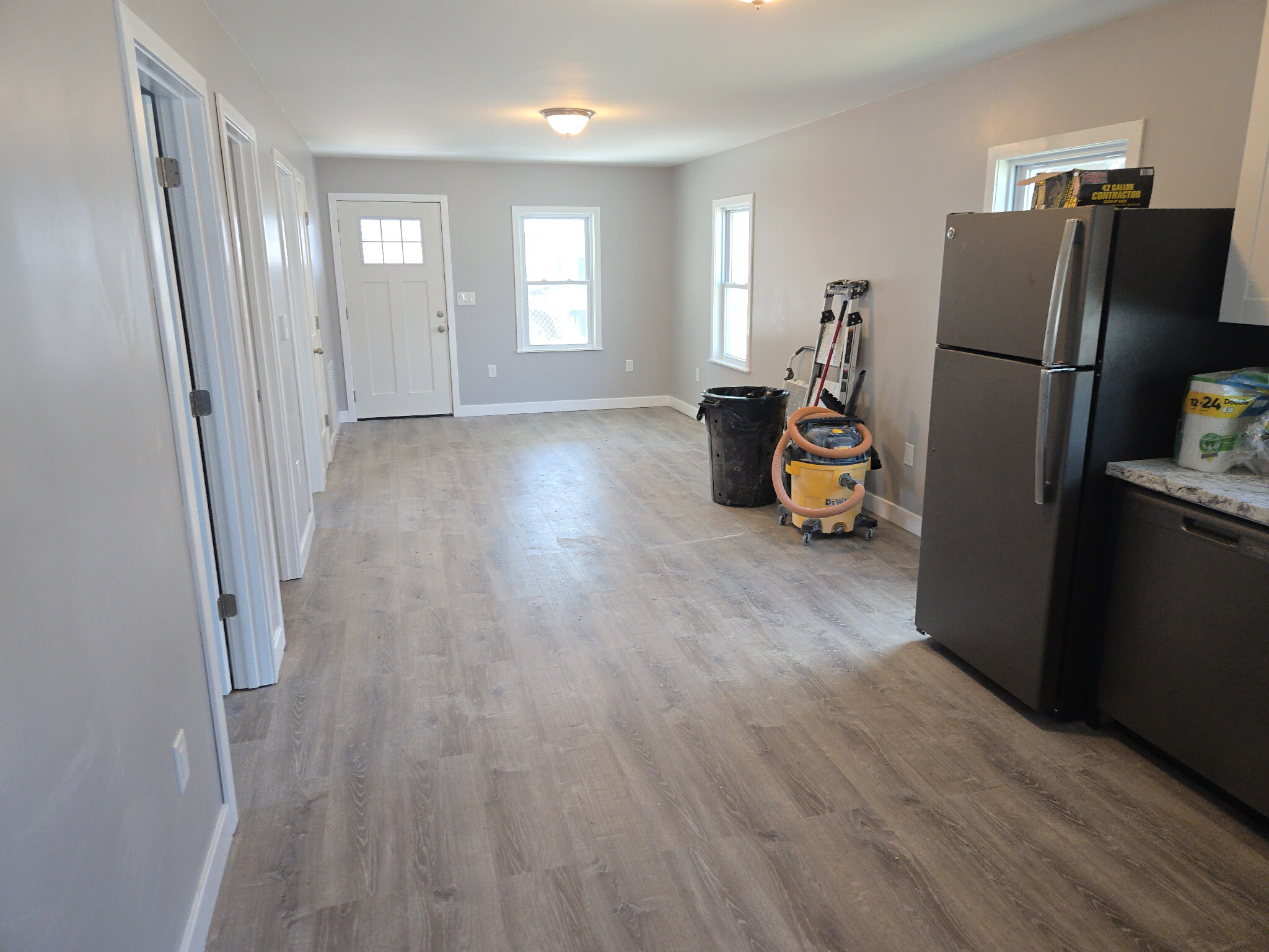 Kitchen/ Living Room view from back of home to front door. - 1025 Ohio St