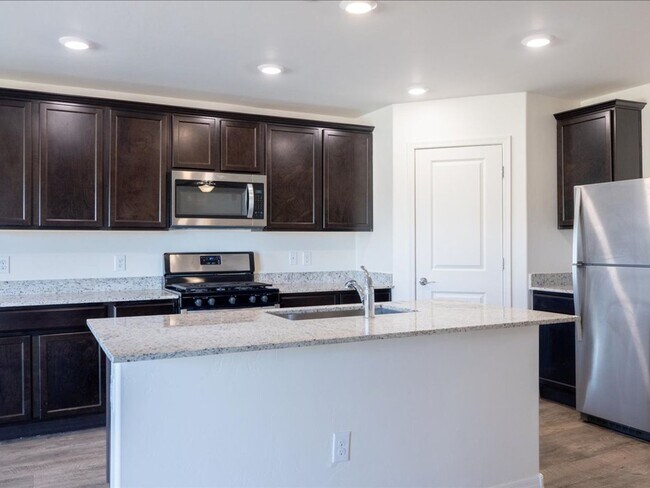 Building Photo - Spacious 4-Bedroom Home with Open Layout & Turf Backyard