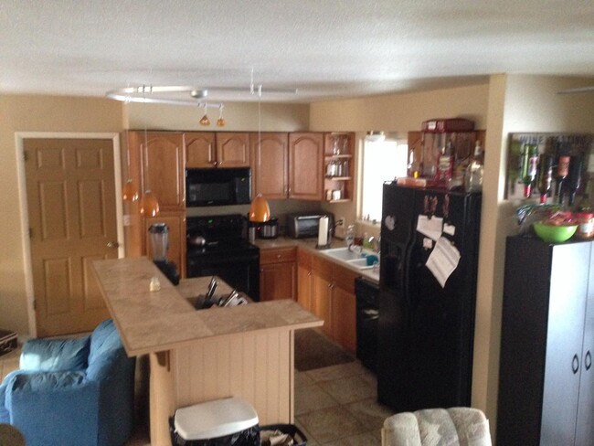 Kitchen open to main room - 1404 Brentwood Dr