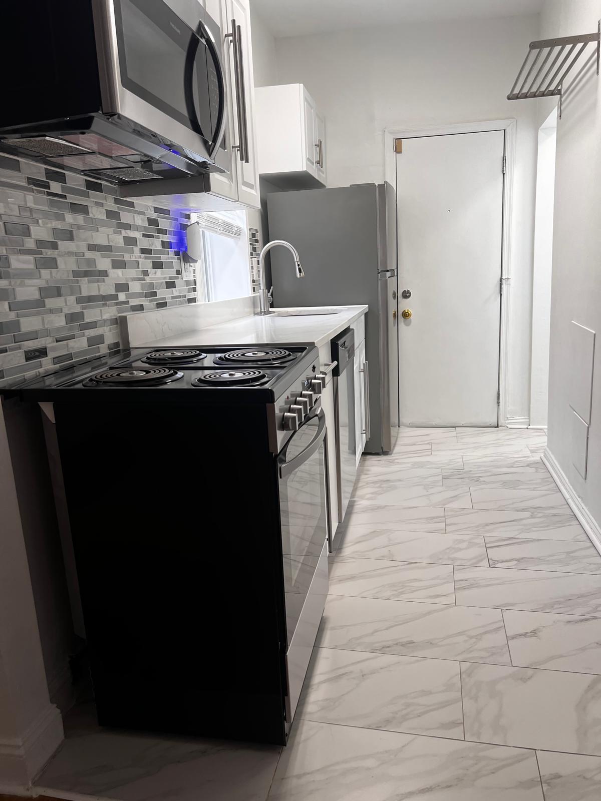 Newly Renovated Stainless Steel Kitchen backdoor to outdoor yard - 2448 Lakeview Ave