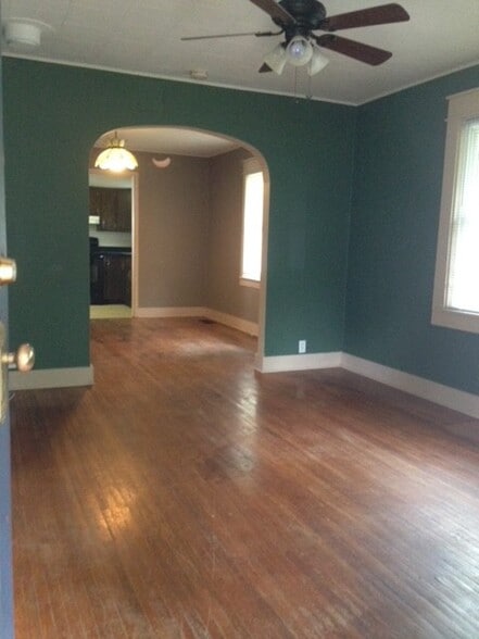 From front door- looking into living room, dining room and kitchen in the back. - 209 E Vermilya Ave