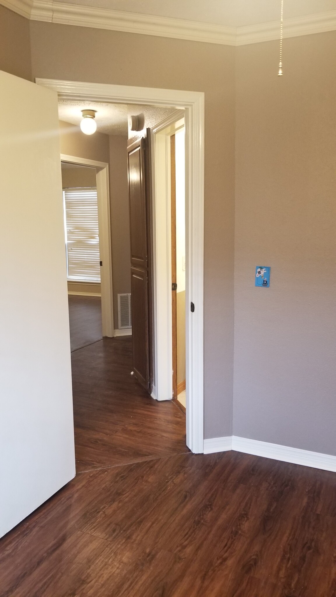 Looking from 3rd bedroom towards master. Bath/storage on the right, 2nd bedroom to the left - 10809 E 100th St N