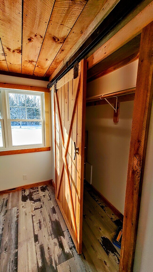 Bedroom closet with barn door - 94 Cross Rd