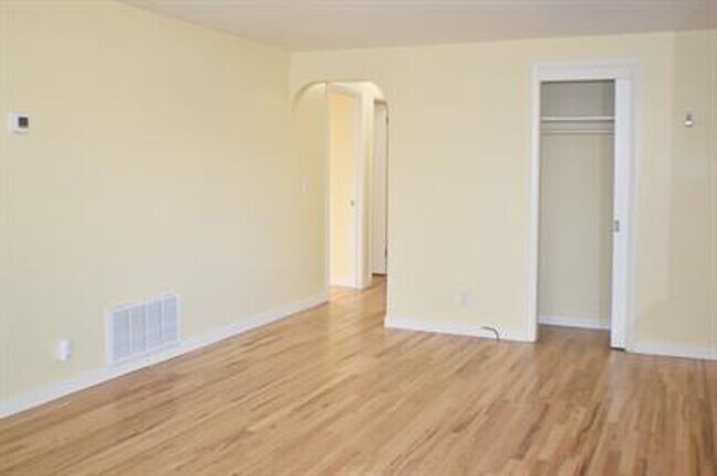 Building Photo - Updated house with original hardwoods and 2-car garage!