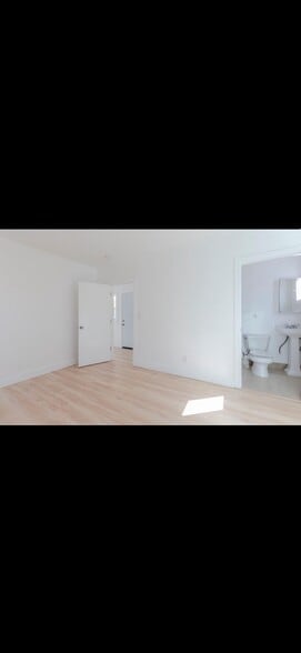 2nd bed room with view of entrance and bathroom - 1704 Miramar St