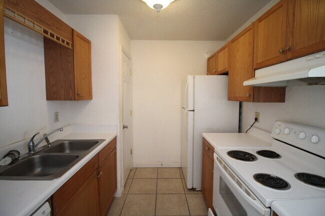 Building Photo - Spacious Vinyl-Sided 2BR Apartment with Open Layout, Private Patio, and Pet-Friendly Options – Av...