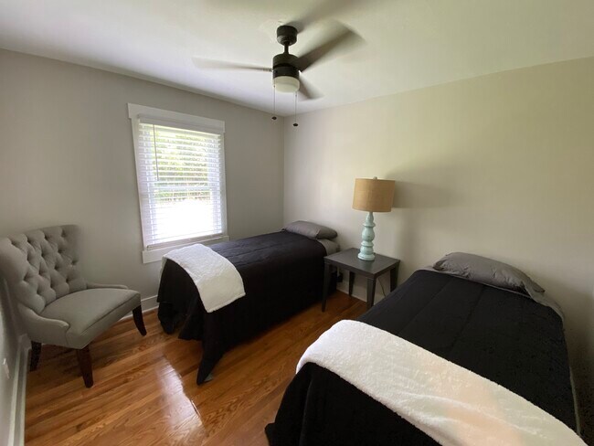 Bedroom with two twin size beds. - 2115 Country Ct