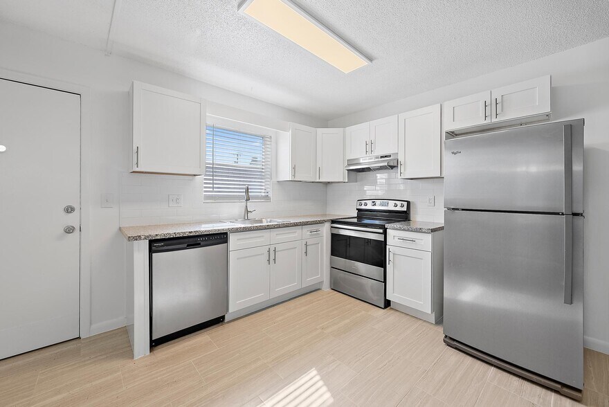 Kitchen with Stainless Steal Appliances - Ocean House Apartments