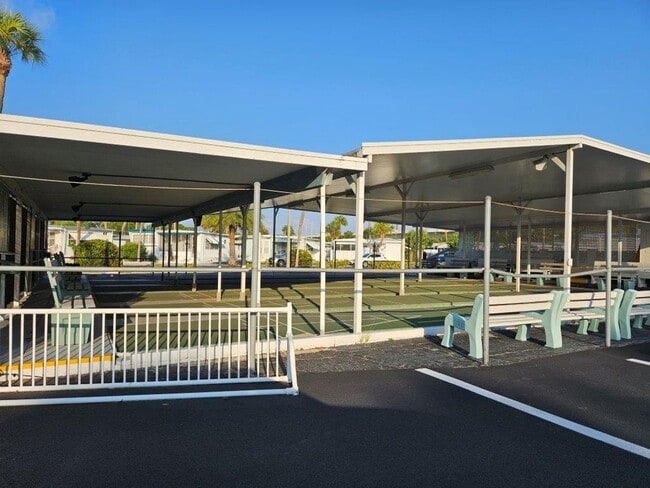 Building Photo - Beautiful fully furnished one bedroom, one bath manufactured home in a 55+ deed restricted gated ...