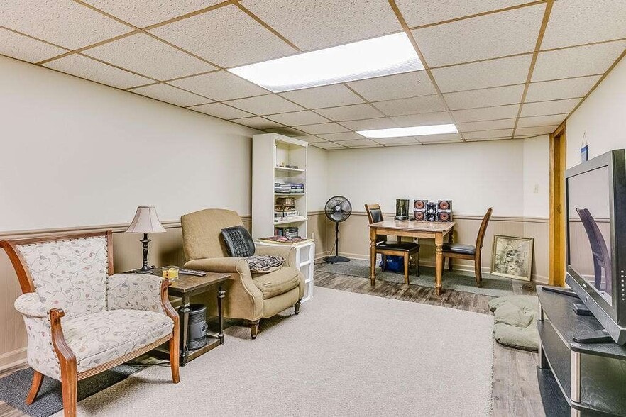 Lower level finished Living Space. Convert it to an office or playroom. - 7021 35th Avenue