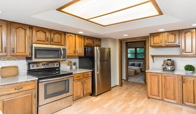 Building Photo - LARGE AND SPACIOUS, YET COZY AND QUAINT RANCH STYLE 4 BD, 3 BA HOUSE WITH DOUBLE ATTACHED GARAGE,...