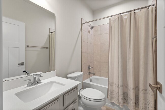 Building Photo - Luxurious three-story townhome with owner's suite and high-end finishes